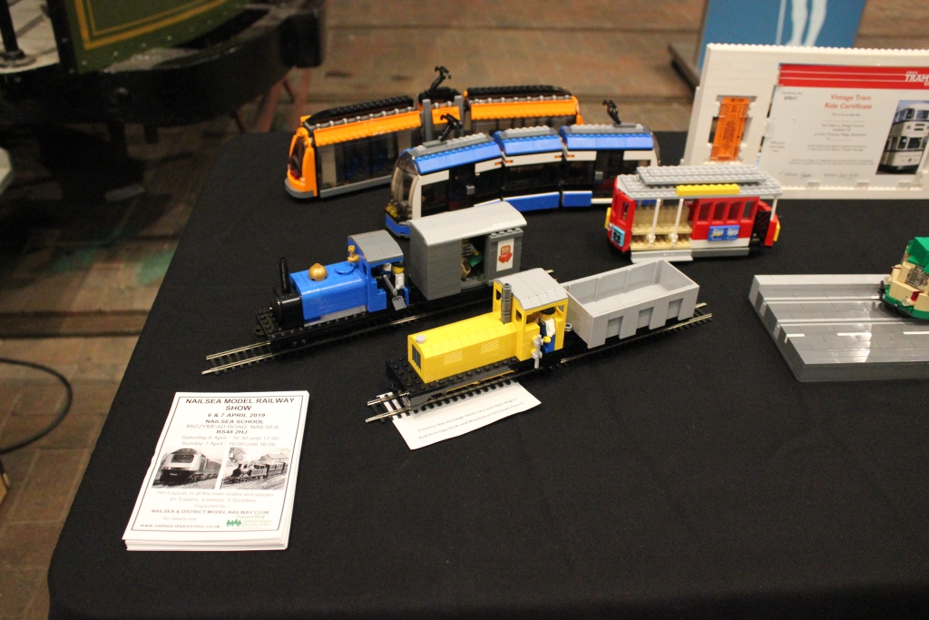 My display of LEGO trams and trains built on OO Gauge model railway chassis'