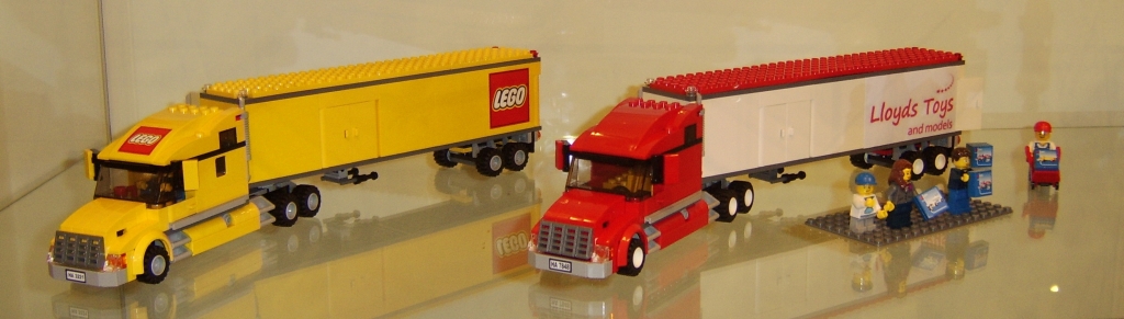 Lego lorry set 3221 and Lloyds Toys coloured version on display.