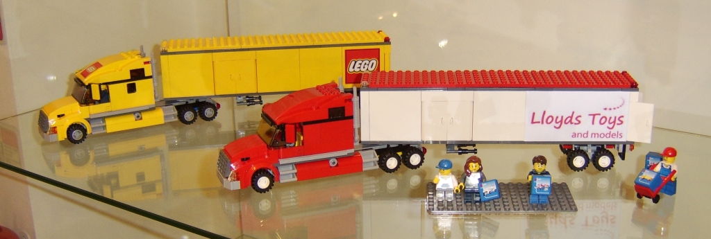 Lego lorry set 3221 and Lloyds Toys coloured version on display.