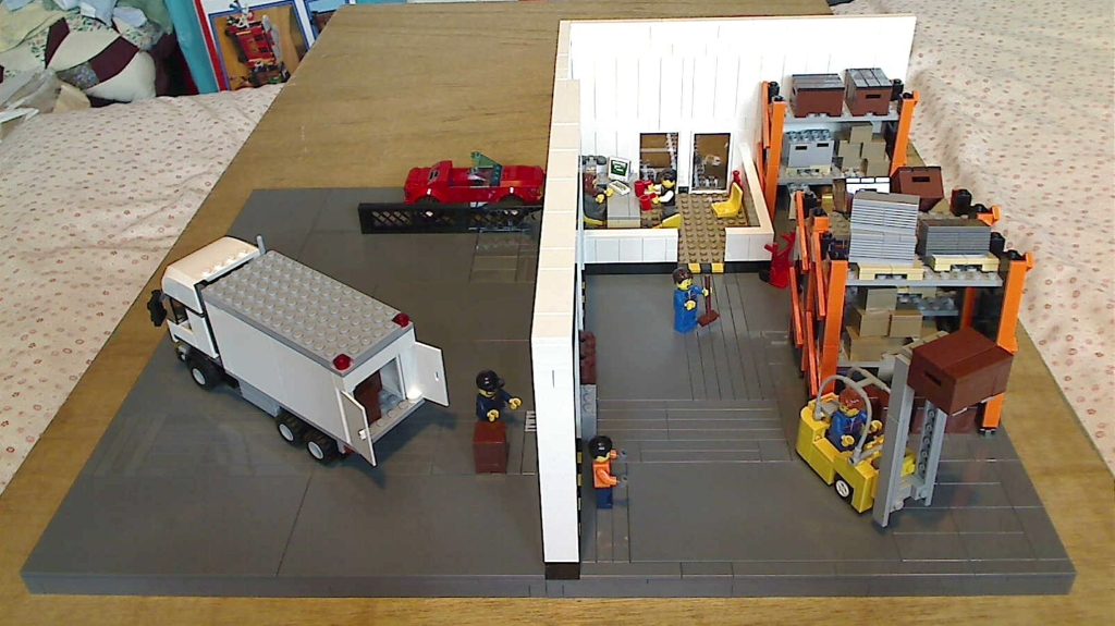 A small scene in a warehouse built from LEGO bricks.