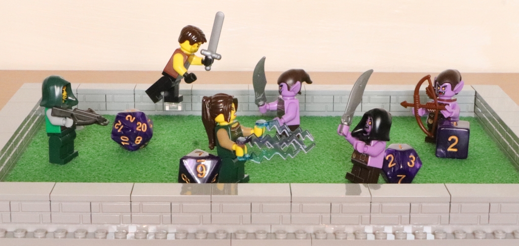 LEGO Minifigures battling in a dice tray.